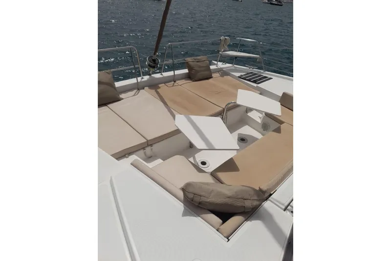  Yacht Photos Pics Luxurious 2017 Bali 4.0 catamaran deck with beige cushions and ocean view.