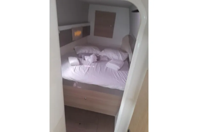  Yacht Photos Pics Cozy cabin bedroom in a 2017 Bali 4.0 yacht with neatly arranged bedding.