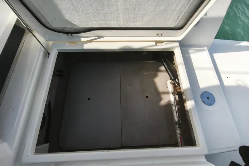  Yacht Photos Pics Open storage compartment on a 2017 Bali 4.0 boat, showing interior details.