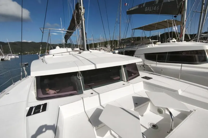  Yacht Photos Pics 2017 Bali 4.0 catamaran docked in marina, clear sky, surrounded by other boats.