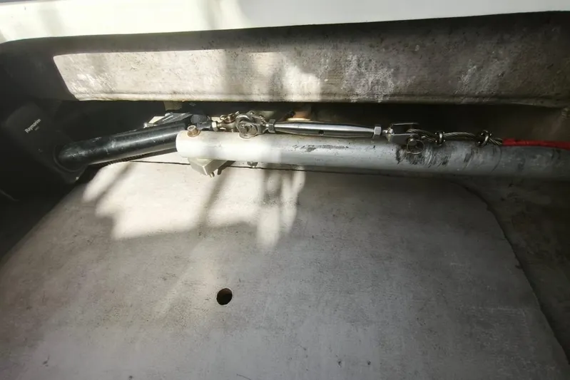  Yacht Photos Pics Boat steering mechanism in a 2017 Bali 4.0 model, featuring cables and hydraulic components.