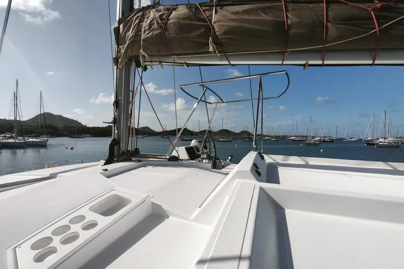  Yacht Photos Pics Sailing yacht Bali 4.0, 2017 model, docked in a scenic marina with clear skies.