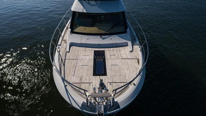 Osiris Yacht Photos Pics 2022 Beneteau Monte Carlo 6 yacht on calm water, aerial view.