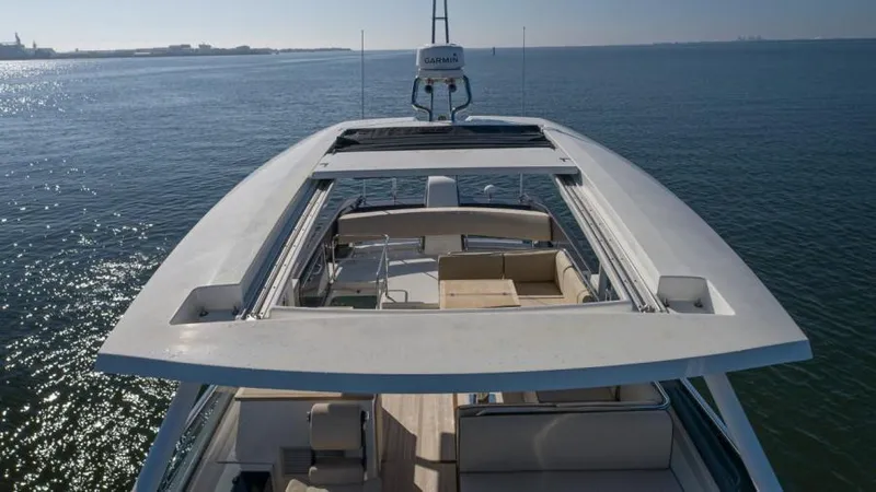 Osiris Yacht Photos Pics 2022 Beneteau Monte Carlo 6 yacht on calm waters, showcasing spacious deck and sleek design.