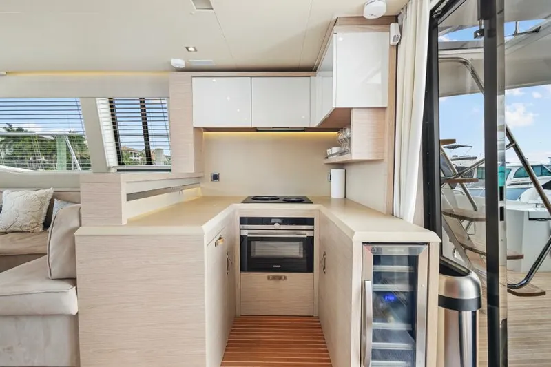 Osiris Yacht Photos Pics Modern kitchen in 2022 Beneteau Monte Carlo 6 yacht with sleek cabinetry and appliances.