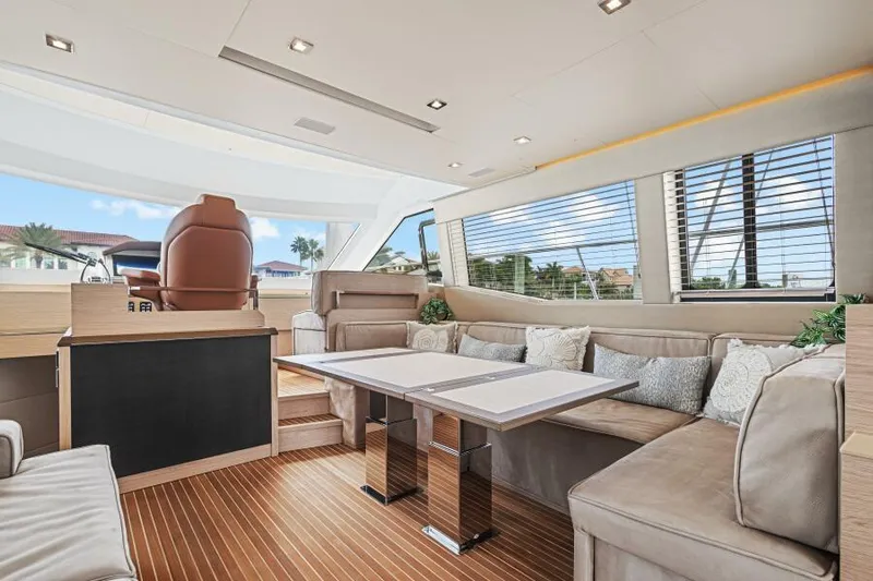 Osiris Yacht Photos Pics Luxurious interior of 2022 Beneteau Monte Carlo 6 yacht with plush seating and modern design.