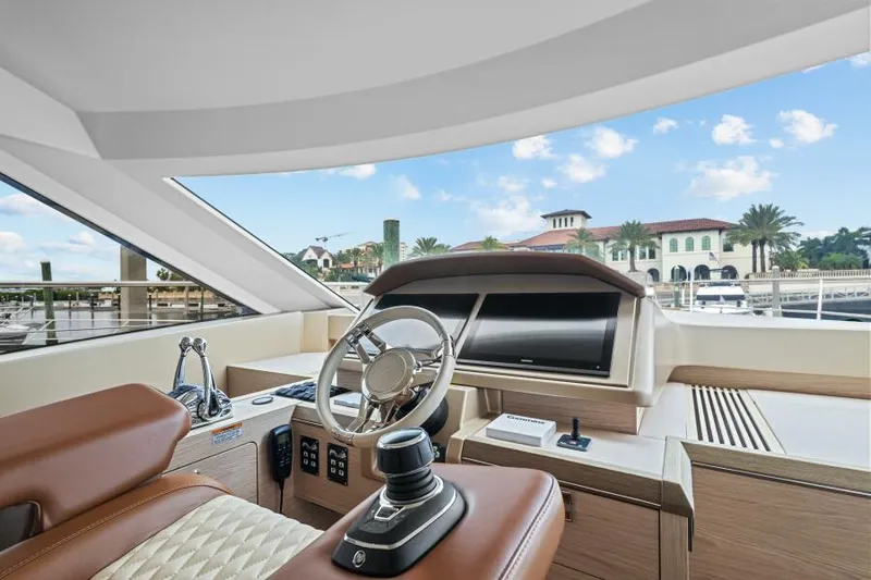 Osiris Yacht Photos Pics Luxurious interior of 2022 Beneteau Monte Carlo 6 yacht with modern helm station.
