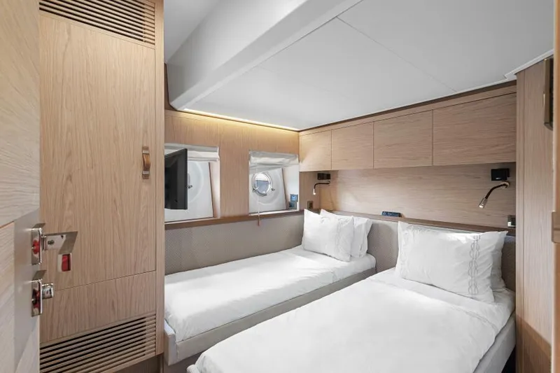 Osiris Yacht Photos Pics Interior cabin of 2022 Beneteau Monte Carlo 6 yacht with twin beds.