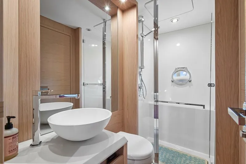 Osiris Yacht Photos Pics Luxurious bathroom in 2022 Beneteau Monte Carlo 6 yacht, featuring modern fixtures and elegant design.