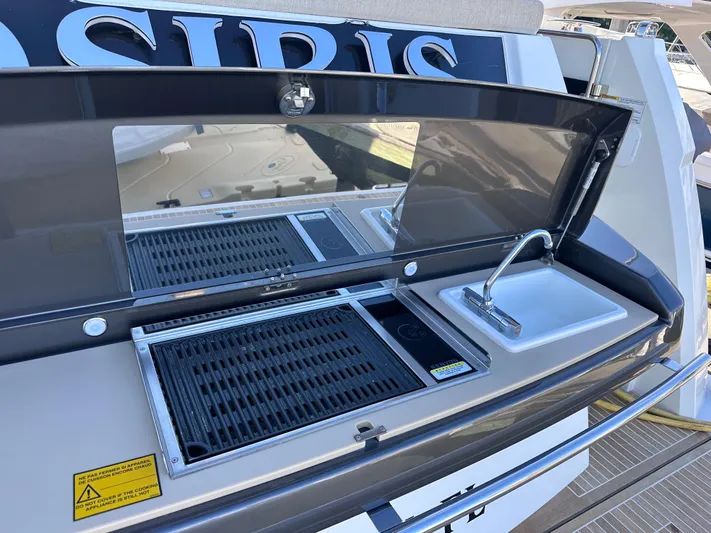 Osiris Yacht Photos Pics Outdoor kitchen on 2022 Beneteau Monte Carlo 6 yacht with grill and sink.