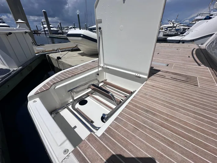 Osiris Yacht Photos Pics Beneteau Monte Carlo 6, 2022 model, open hatch on deck at marina.