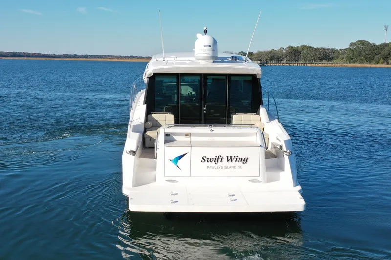  Yacht Photos Pics 2016 Tiara Yachts 50 Coupe "Swift Wing" on calm waters, Pawleys Island, SC.