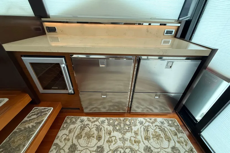  Yacht Photos Pics Luxurious 2016 Tiara Yachts 50 Coupe interior with modern kitchen appliances and elegant design.