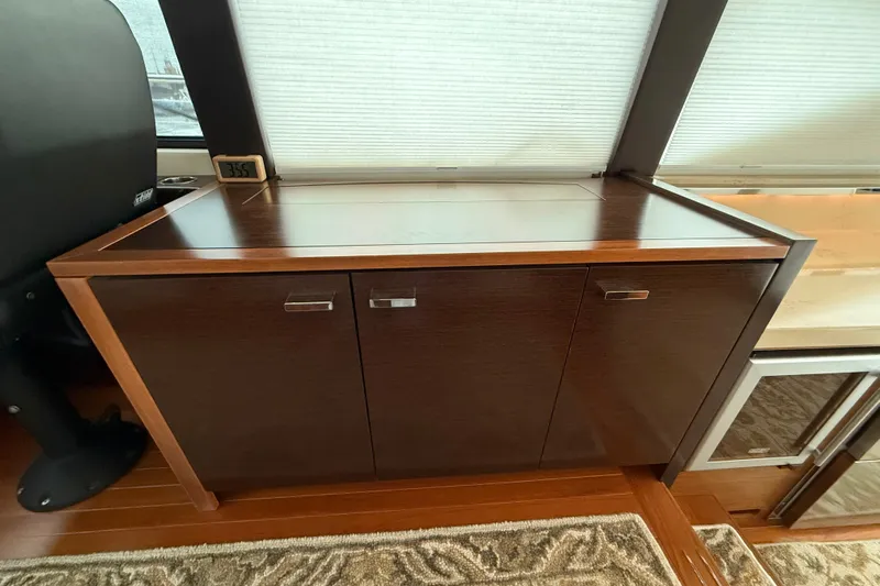  Yacht Photos Pics Interior of 2016 Tiara Yachts 50 Coupe featuring elegant wooden cabinetry.