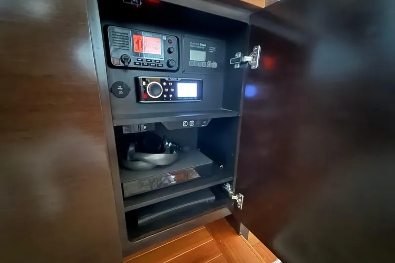  Yacht Photos Pics 2016 Tiara Yachts 50 Coupe electronics cabinet with navigation and audio equipment.