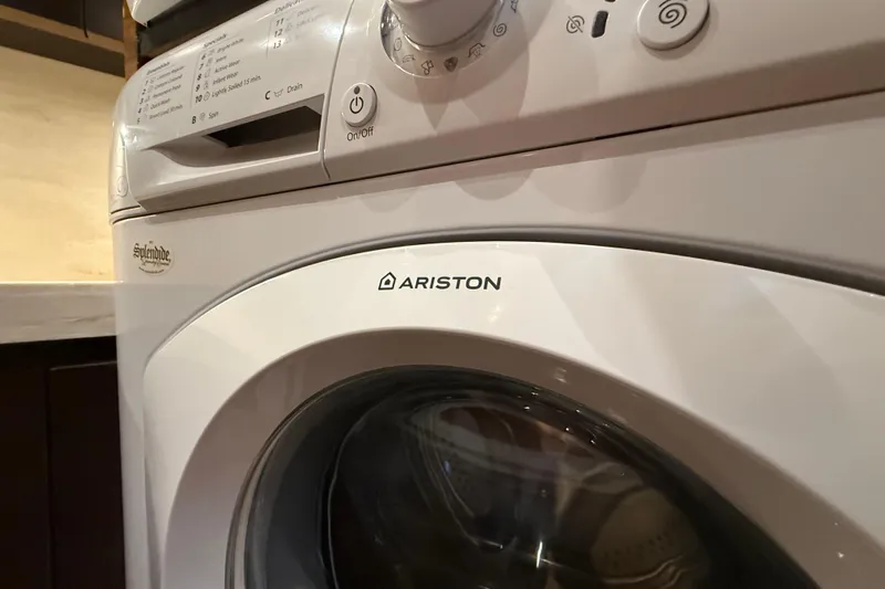  Yacht Photos Pics Ariston washing machine in a 2016 Tiara Yachts 50 Coupe interior.