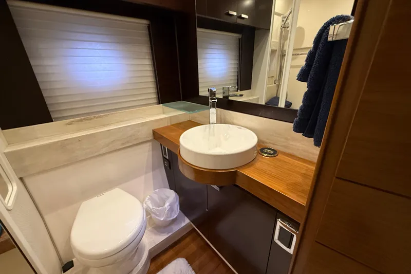  Yacht Photos Pics Luxurious bathroom in 2016 Tiara Yachts 50 Coupe with modern fixtures and elegant design.