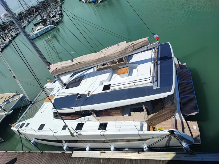  Yacht Photos Pics 2025 Fountaine Pajot Catamaran Aura 51 docked in a marina, top view.