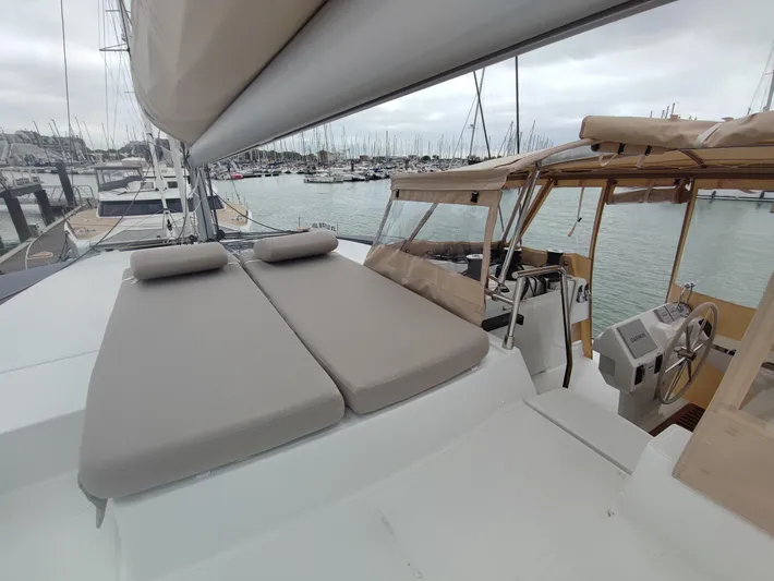  Yacht Photos Pics 2025 Fountaine Pajot Catamaran Aura 51 with spacious deck and helm in marina.