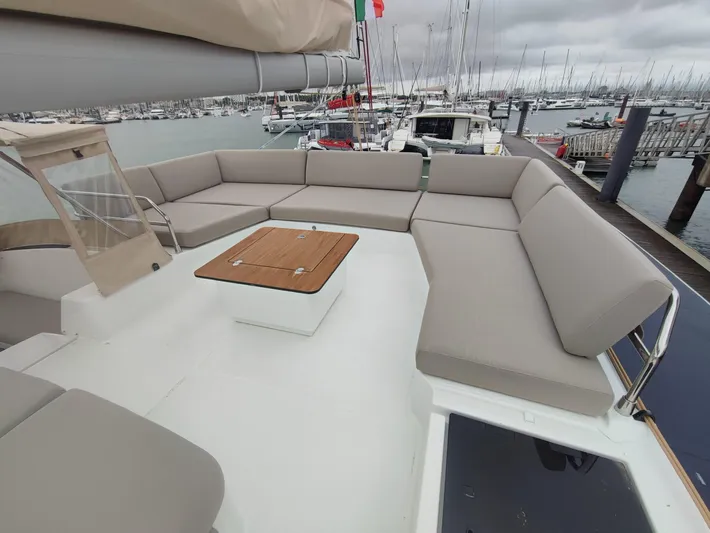  Yacht Photos Pics 2025 Fountaine Pajot Catamaran Aura 51 with spacious deck seating at marina.