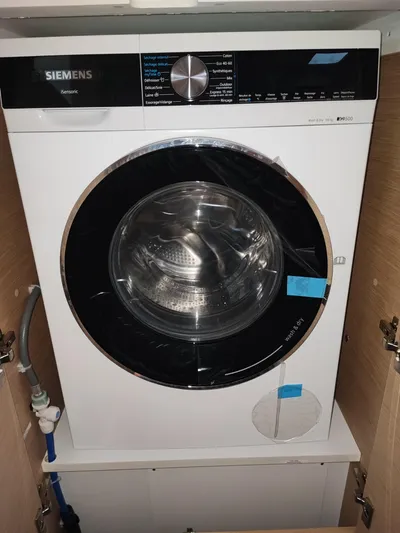  Yacht Photos Pics Siemens washing machine installed in a wooden cabinet on a Fountaine Pajot Catamaran Aura 51.