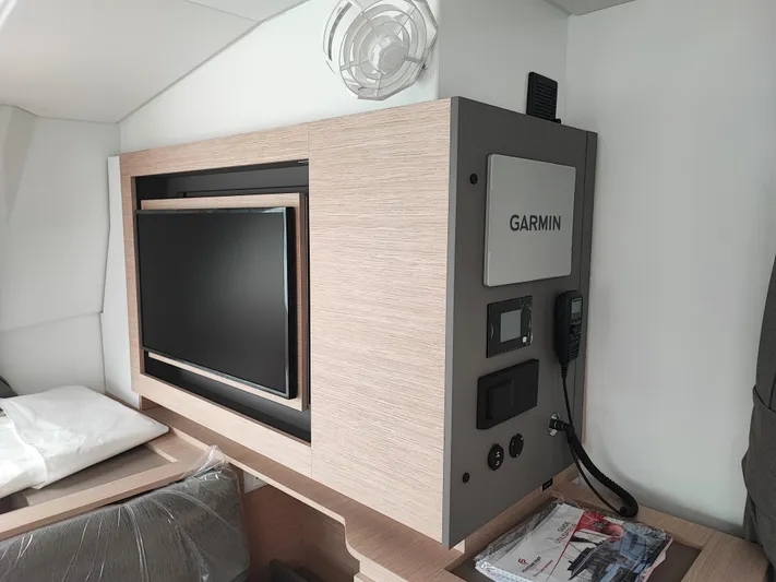  Yacht Photos Pics 2025 Fountaine Pajot Aura 51 Catamaran interior with Garmin navigation system and TV.