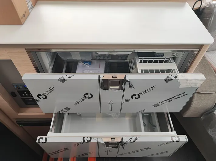  Yacht Photos Pics Modern kitchen drawers in 2025 Fountaine Pajot Catamaran Aura 51, featuring sleek design and ample storage.