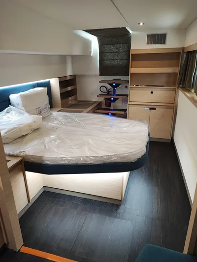  Yacht Photos Pics Luxurious interior of 2025 Fountaine Pajot Catamaran Aura 51, featuring a modern bedroom design.