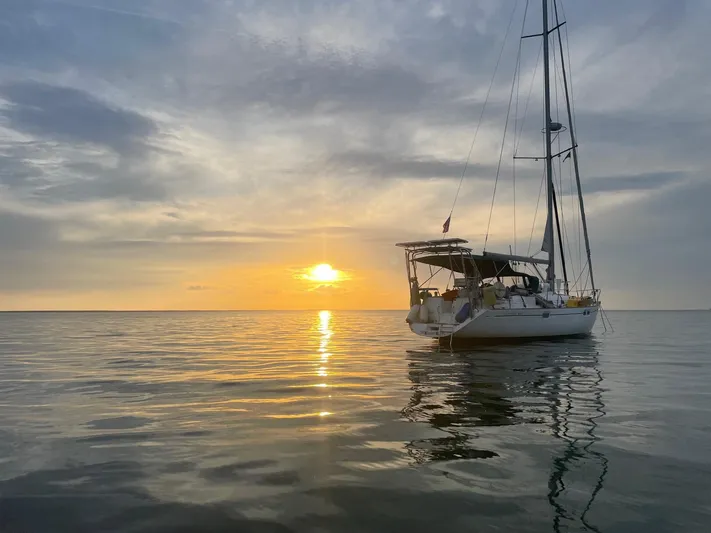 Layla Yacht Photos Pics Beneteau Oceanis 461 sailboat on calm sea at sunset, 1997 model.