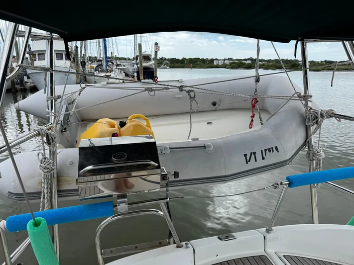 Layla Yacht Photos Pics Sailboat Beneteau Oceanis 461, 1997 model, with inflatable dinghy and grill, docked at marina.