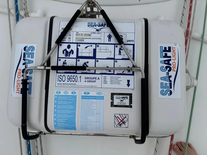 Layla Yacht Photos Pics Life raft on 1997 Beneteau Oceanis 461 sailboat, labeled "SEA-SAFE PRO-LIGHT" with safety instructions.