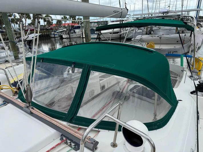 Layla Yacht Photos Pics Beneteau Oceanis 461 sailboat, 1997 model, with green canopy docked at marina.