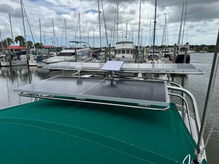 Layla Yacht Photos Pics Beneteau Oceanis 461 sailboat with solar panels docked at a marina, 1997 model.