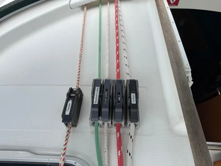 Layla Yacht Photos Pics Close-up of rope clutches on a 1997 Beneteau Oceanis 461 sailboat deck.