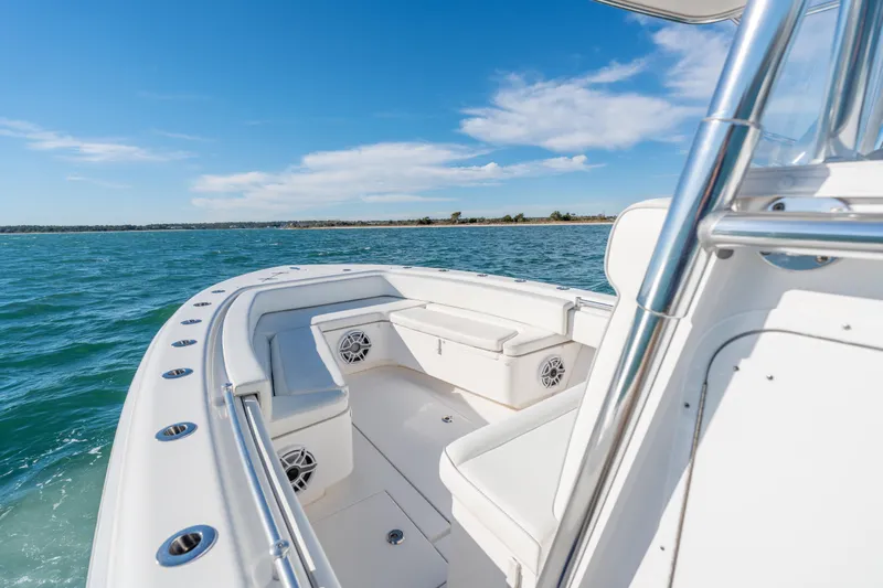  Yacht Photos Pics 2023 Contender 28 Sport boat on open water, featuring sleek design and comfortable seating.