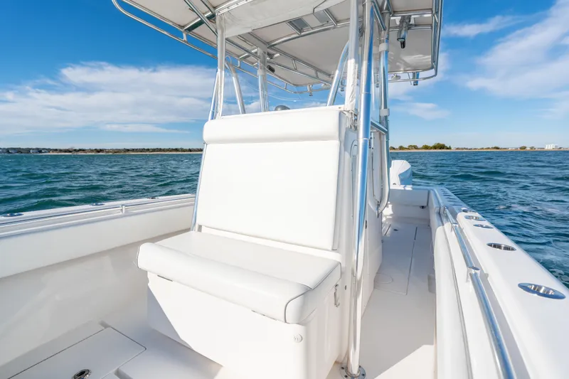  Yacht Photos Pics 2023 Contender 28 Sport boat on water, featuring sleek white seating and modern design.