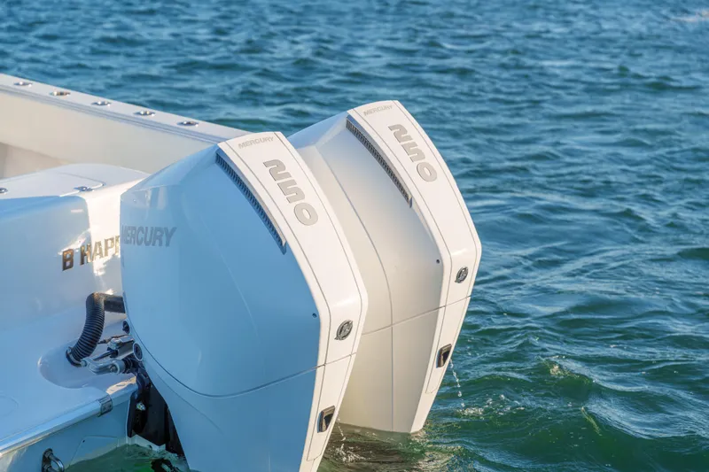  Yacht Photos Pics 2023 Contender 28 Sport boat with dual Mercury 250 outboard engines on water.