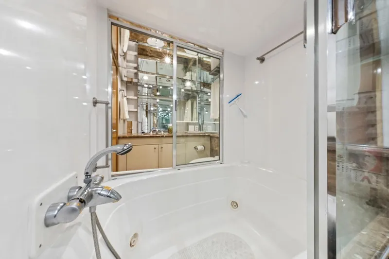  Yacht Photos Pics Luxurious bathroom in 2000 Hatteras 74 Cockpit Motor Yacht with modern fixtures.