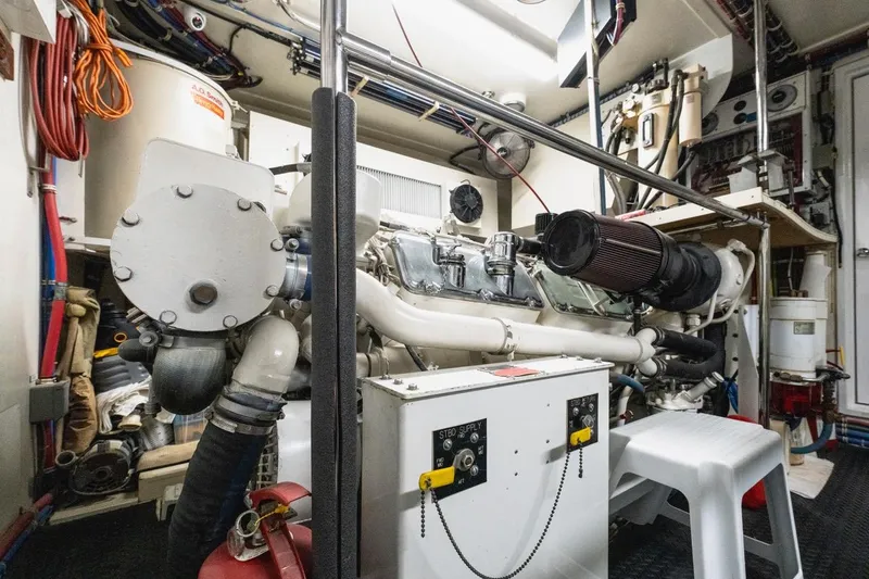  Yacht Photos Pics Engine room of 2000 Hatteras 74 Cockpit Motor Yacht, showcasing mechanical components and equipment.