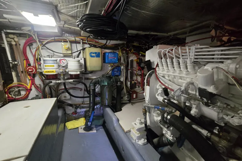 New Bearings Yacht Photos Pics Engine room of a 2000 Nordic Tug 42 Flybridge, showcasing mechanical components and wiring.