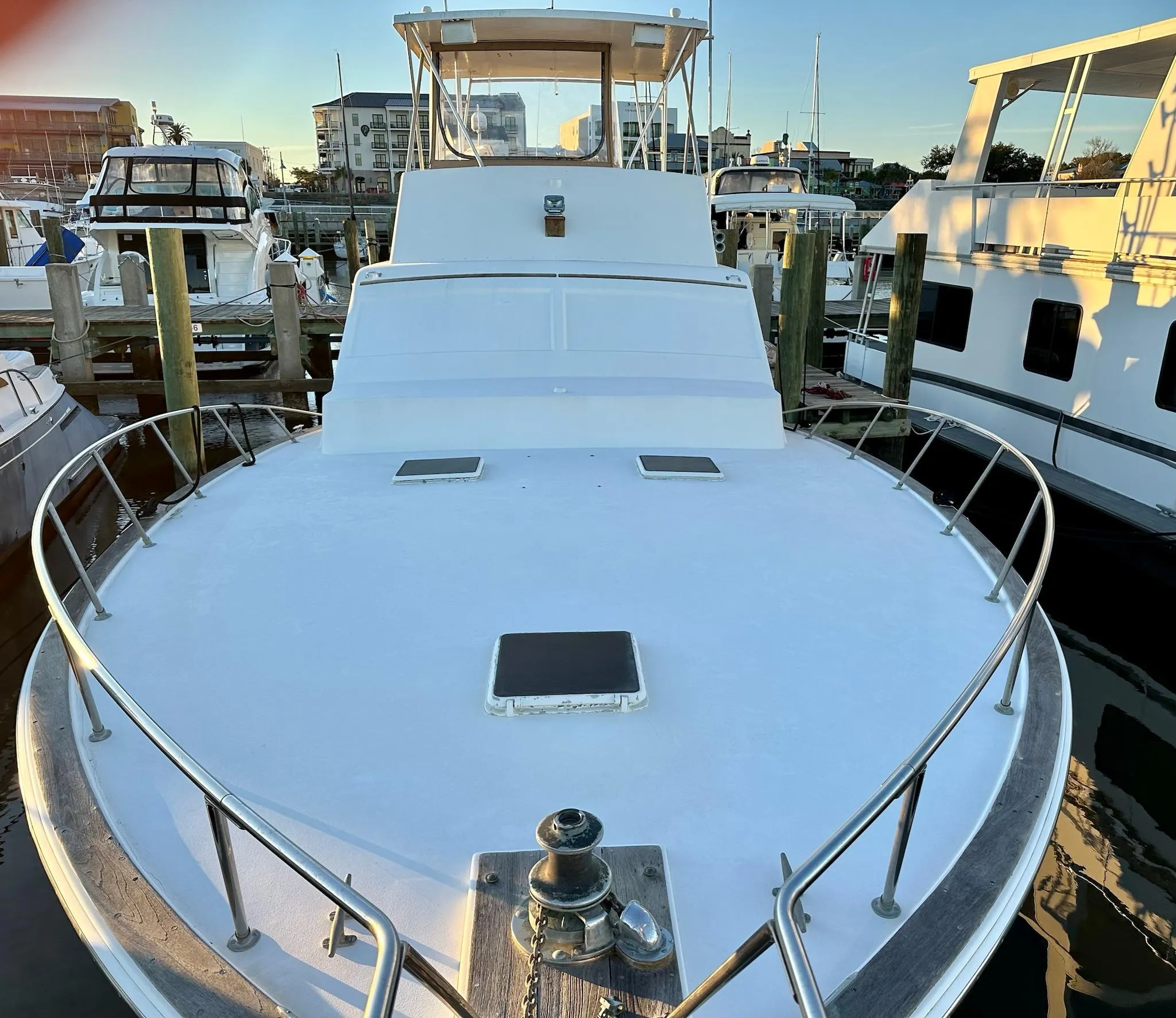 1987 Post 46 SPORT yacht docked at marina, showcasing spacious deck and sleek design.