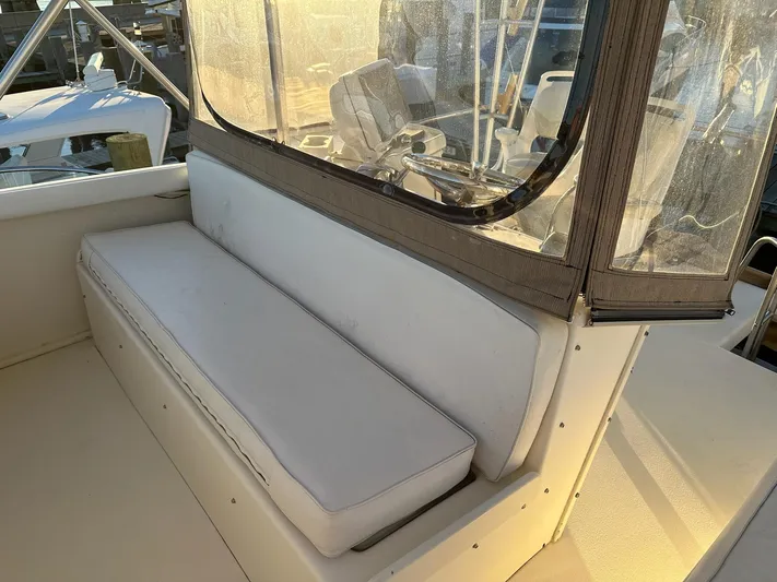 Charisma Yacht Photos Pics 1987 Post 46 SPORT boat interior with white seating and clear enclosure.