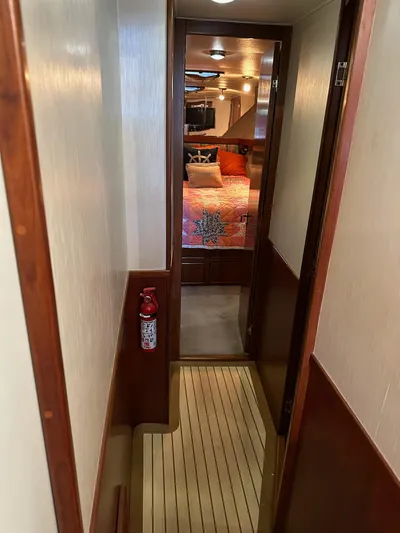 Charisma Yacht Photos Pics Narrow hallway on 1987 Post 46 SPORT yacht leading to a cozy bedroom.