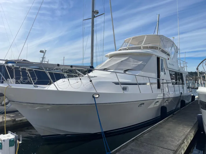  Yacht Photos Pics 2002 Canoe Cove 50 Pilothouse Luxury Yacht docked at marina.