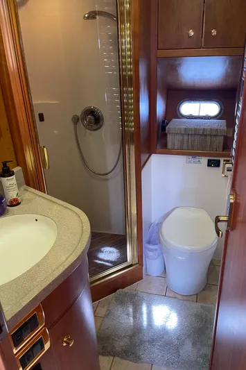  Yacht Photos Pics Luxurious bathroom in 2002 Canoe Cove 50 Pilothouse Yacht with shower and modern amenities.