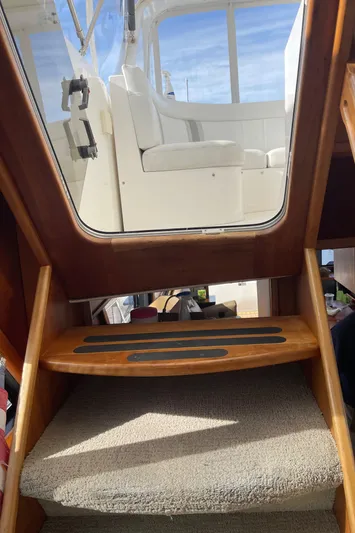  Yacht Photos Pics Interior view of 2002 Canoe Cove 50 Pilothouse Yacht, showing stairs and seating area.