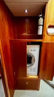  Yacht Photos Pics Laundry area with washer in 2002 Canoe Cove 50 Pilothouse Luxury Yacht.