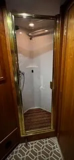  Yacht Photos Pics Shower area in 2002 Canoe Cove 50 Pilothouse Luxury Yacht with wooden accents.