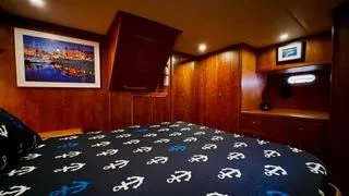  Yacht Photos Pics Luxurious wooden cabin interior of a 2002 Canoe Cove 50 Pilothouse Yacht.