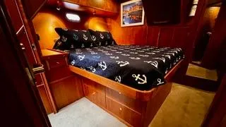 Yacht Photos Pics Luxurious bedroom in 2002 Canoe Cove 50 Pilothouse Yacht with anchor-themed bedding.
